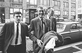 Leary was arrested on drug charges several times. Here, he is escorted by U.S. Customs agents in October 1966 for failing to register at LaGuardia Airport as a drug offender on return from an international (Canadian) trip. 