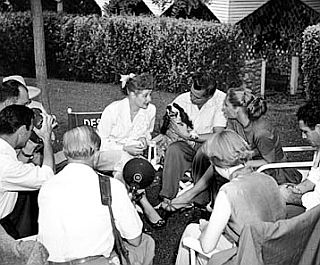 Sept 12th, 1953: Los Angeles Times photo shows Lucille Ball and Desi Arnaz meeting with the press in the back yard of their home. Desi is holding their dog, Pinto. 