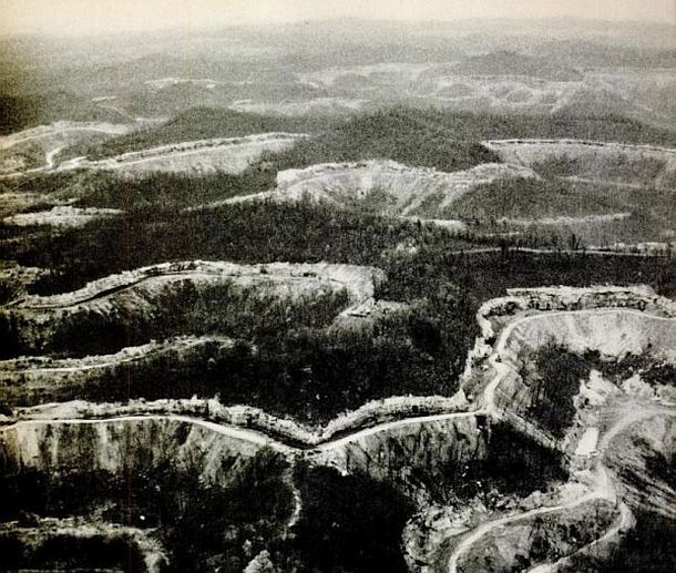 Circa 1967:  Aerial view of contour strip mining's handiwork in Eastern Kentucky, with gouged mountainsides running for miles to the far horizon. Source: “These Murdered Mountains,” Life magazine, January 12, 1968, photo by Bob Gomel. 