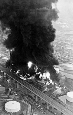 Aug 1975: Aerial view of Gulf Oil refinery fire in Phila. PA, looking down on the Penrose Ave. Bridge that crossed the refinery grounds.