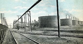 Circa 1910: Postcard rendition of oil storage tanks at southern tip of Lake Michigan where the sprawling Standard Oil refinery at Whiting, Indiana would become one the world’s largest.