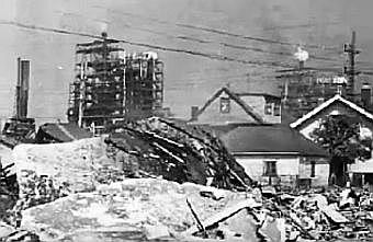Photo of some of the large debris thrown by the explosion into residential areas. Whiting refinery fire, Aug 1955.