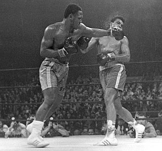 March 1971: Frazier hits Ali with a left during fight.