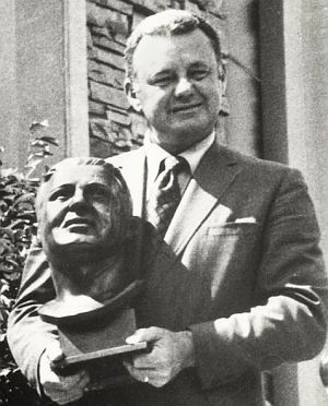 1971: Norm Van Brocklin with his hall of Fame bust at induction ceremonies at the Pro Football Hall of Fame.