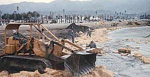 1969: Bulldozers formed piles of oil-soaked sand and cleanup wastes on the beaches in Santa Barbara  that were hauled away to landfills by large trucks. 