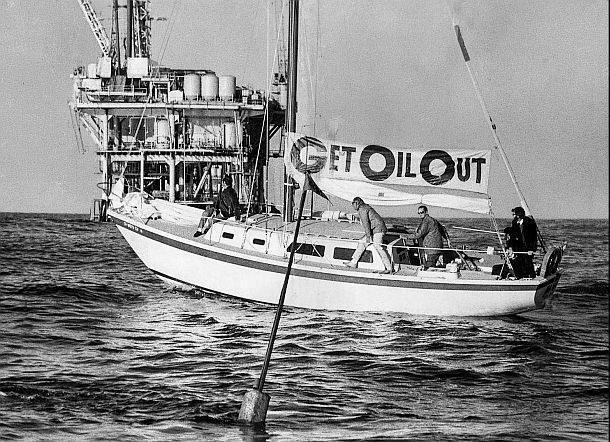 1969-1970: This photo of a boat being piloted by the Santa Barbara environmental group, Get Oil Out!, was taken by Los Angeles Times photographer Frank Q. Brown and was published on the front page of the January 29 1970 Los Angeles Times. The group at the time, on the first anniversary of the spill, was dropping a buoy in the Santa Barbara Channel to mark the area where the spill first occurred.  Get Oil Out! had also sponsored an August 1969 fleet of protest boats to stage a “fish-in” in a failed attempt to block the installation of a Sun Oil drilling platform. 