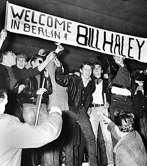 Oct 1958: Bill Haley & Comets being welcomed to Berlin, Germany by a throng of happy fans.  AP photo.
