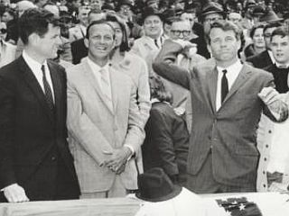 17 April 1964: Robert F. Kennedy throws out the game ball at baseball’s opening day at Fenway Park with Ted Kennedy, Stan Musial and others looking on.