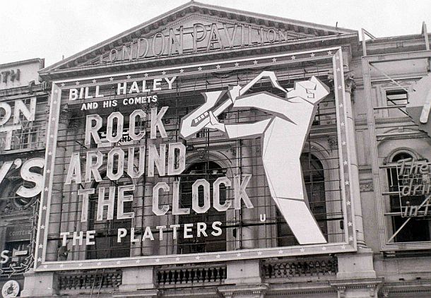 1956: Bill Haley and His Comets receive top billing at the London Pavilion for the film, “Rock Around The Clock,” which produced enthusiastic teen audiences throughout England and beyond – and some rioting as well.