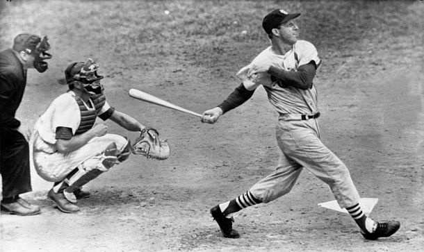 St. Louis Cardinal baseball great, Stan Musial, connecting with one in the prime of his career.