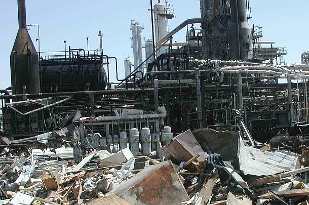 Ground-level view of the debris field and twisted and charred piping in the aftermath of the March 2005 explosion at BP’s Texas City, Texas oil refinery.