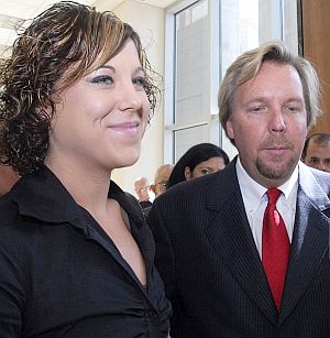 Nov 9th, 2006: Eva Rowe and attorney Brent Coon talking with reporters after BP Texas City settlement.