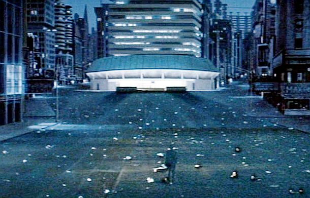 Scene from “Soylent Green” showing a lone person in the middle of the grimy city, heading toward one of the “going home” centers, where state-assisted suicide is offered as an inviting alternative to the misery of living.