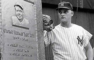 1961. Roger Maris, haunted by Babe Ruth all year, shown at the Babe's monument, then behind Yankee Stadium's center field.