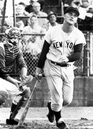 1961. Roger Maris watching one of his home runs take flight.