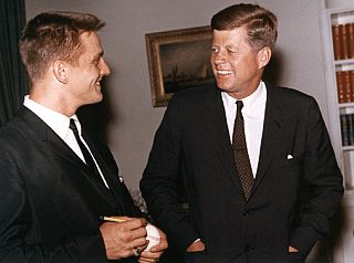 April 27, 1962. Roger Maris at the White House, signing a baseball for U.S. President, John F. Kennedy. Click for copy.