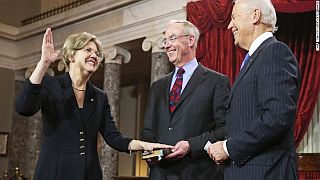 Jan 2013. Senator Warren in ceremonial swearing-in photo with husband Bruce Mann and Vice President Joe Biden.