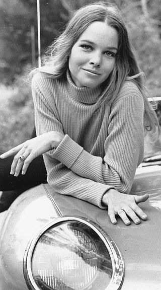 Michelle Phillips; devilish pose and “Mona Lisa” smile.