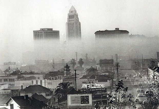 1956 photo of smog in downtown Los Angeles, with the City Hall building at center.