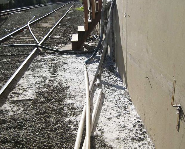 Photo of nurdles on the ground at rail docking area of Metro Poly Corp of  San Leandro, CA. One of more than a dozen photos of nurdle spills taken by the San Francisco Bay Area Water Board at Metro Poly during 2009-2010 inspections. Metro Poly later complied with abatement order adding multiple containment improvements.