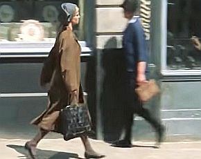 ...when he believes he sees Lara walking on the street, just outside the streetcar...