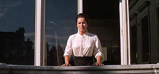 Tonya, anticipating Yuri’s homecoming after the war, looks out from the balcony of her home over the streets of Moscow, and she will soon become excited seeing Yuri approaching in the distance.