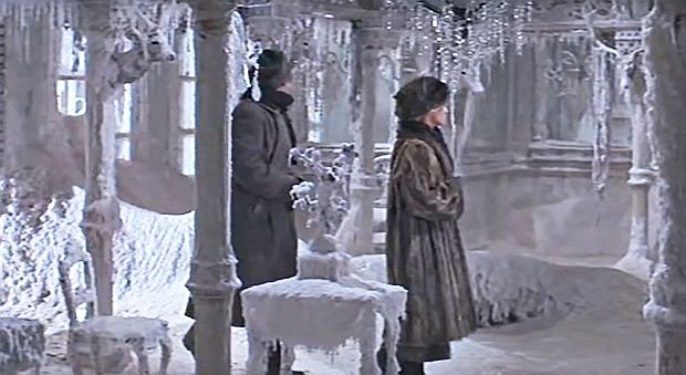 Lara and Zhivago entering the frozen interior of the Gromeko home at Varykino, which has taken on the look of a winter-wonderland ice palace. 