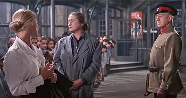 Yevgfraf with Lara (far left) visiting one of the orphanages attempting to find her and Zhivago’s missing daughter. But their search is not successful. 