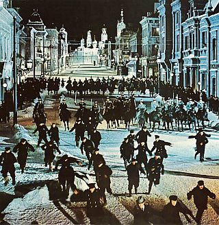 The Czar’s  cavalry run down and slaughter street protestors, as Zhivago happens to witness the horror from a balcony.