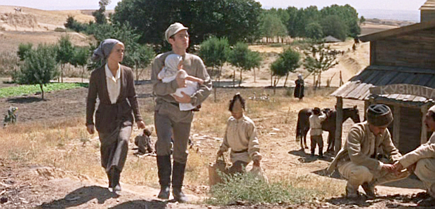 Lara and Pasha, now married, are shown here with their daughter, living in the country. On one visit to town, shown here, Pasha meets with a recruiter and joins the army.  However, later, he would go missing in action. 