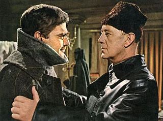 Half-brother Yevgraf with Yuri at home after fence-wood pilfering, arranges for Yuri & family to leave Moscow.