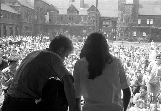 July 27, 1963. Bob Dylan and Joan Baez finishing their set at the Newport Folk Festival, famously photographed by Rowland Scherman  (rowlandscherman.com). Special Collections, University of Massachusetts Amherst Libraries.
