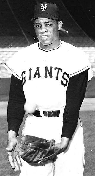 1954. Willie Mays, 23 years old, offering a “basket catch” pose for photographer.  Sporting News / Greene.