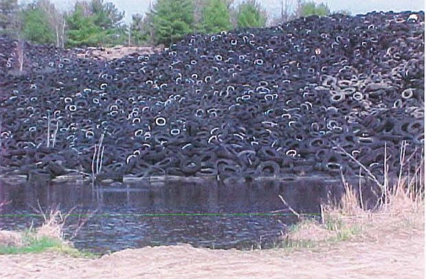 A portion of Botelho tire dump; Bowdoin. ME from earlier photo published in Maine DEP report, January 2000. 